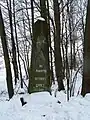 Monument in Guty built in 1898 to commemorate the construction of a road. Inscription is in Polish.