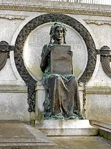 The tomb of historian Henry Charles Lea is adorned with a bronze sculpture of Clio, the muse of history, by Alexander Stirling Calder