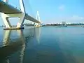 Mouth of the Haidian River entering Haikou Bay, with Haikou Century Bridge on the left, and Haidian Island on the opposite shore.