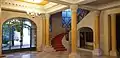 The large entrance hall with its lights, staircase and glassware by Francis Chigot.