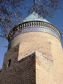 The blue turquoise conical dome of the Mausoleum of Hamdollah Mostowfi "the explorer" in Qazvin