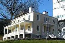 View of Hamilton Grange, a two-story clapboard house, from 141st Street