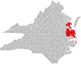 Jurisdictions in the Hampton Roads MSA are colored in red. Jurisdictions in the CSA, but not the MSA, are colored in pink.