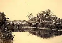 Front view of the North Gate with moat (1885)