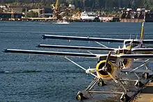 A lineup of 2 DHC-2s and a DHC-3