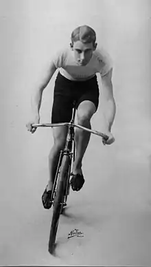 A man on his bicycle headed towards the camera