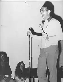 Harvey Milk laughs while speaking at Glide Memorial Church