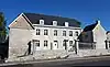 House: walls and roof, fence wall with blue stone pillars and wrought iron gate