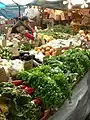 Merchant arranging produce, 2008