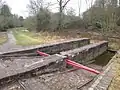 Top of the incline, showing original-pattern bridge rail. The normal water level is shown by the extent of the staining on the wall