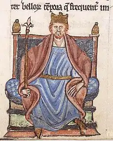 Miniature depiction of Henry II; the red-haired king is crowned and seated on a throne, adorned with a red and blue garment tied with a golden belt at the waist, holding a sceptre.