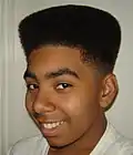 Image 27African-American teenager with Hitop fade, popular in the early 1990s. (from 1990s in fashion)