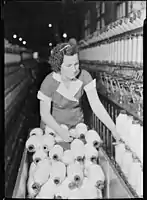 Pickett Yarn Mill. Frame hand doffing spools off speeder - highly skilled. 1937