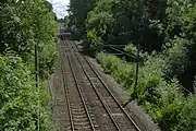 High Royds Hospital Railway junction location in Menston, West Yorkshire; the track curved in on the right and ran under the bridge that the photographer is on