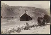 Hinemihi Meeting House at Te Wairoa immediately after the 1886 eruption of Mount Tarawera.