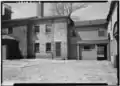 Rear courtyrard showing rear wing of house, 1958