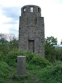 Summit rock on the Hohe Acht with the Kaiser Wilhelm Tower behind