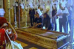 The Stone of Unction – the traditional site of the anointing of Jesus's body after the crucifixion – in the Church of the Holy Sepulchre in 2007.