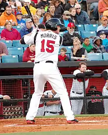 A baseball player in white