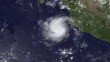 A visible satellite image of a small yet well-developed hurricane in the open East Pacific on July 2.