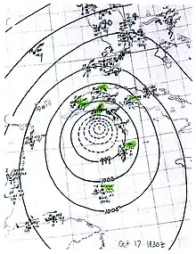 A map showing the cyclone's isobars with nearby weather station observations plotted.