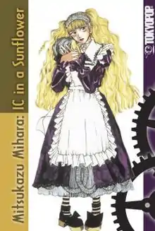 A blonde maid holding a severed head