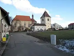 Centre of Březno with the church and bell tower