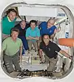 Expedition 31 posing inside the docked Dragon capsule on 29 May 2012.