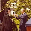 Archbishop Iakovos receives the Presidential Medal of Freedom from President Carter