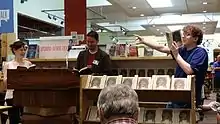 At Powell's Bookstore in Portland, Oregon. Doescher (center) does a reading of The Jedi Doth Return with former classmate Anne Huebsch (left) and audience member Micah Read from Lincoln High School (right). July, 2014.