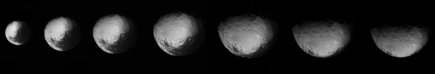 This series of images of Iapetus' north pole by Voyager 2 became the first-ever hints on the existence of the moon's equatorial ridge. The white and grey dots below each images (Iapetus' equator) will later be revealed to be Voyager Montes by Cassini. Taken on August 22, 1981.