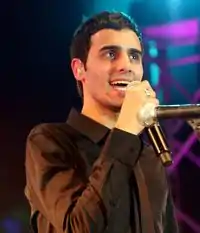 Yaniv singing at a concert in Tel Aviv, Israel