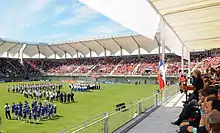 Photo from the stands of players and officials on the pitch