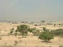 Tanks of the Indian Army Armoured Corps and BMP-2 IFVs during a training exercise in 2006.