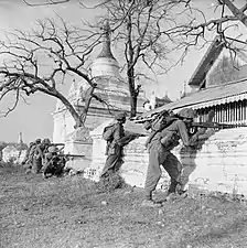 19th Division fire on Japanese strong point among pagodas on Mandalay Hill