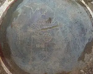 The brass disc officially marking Indiana's border with Michigan and Ohio