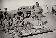 Indian medical orderlies attending to wounded soldiers with the Mesopotamian Expeditionary Force in Mesopotamia during World War I.