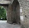 Recycled stones dating from antiquity used in the construction of the upper gate. One of the stones has a fragment of an ancient Greek inscription