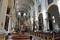 Interior of the church and its central altar with painting of St. Raphael