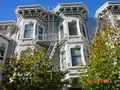 Projecting cornice of a painted wooden Italianate residence