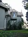 Southeast-facing second floor bay window added by widow Moss