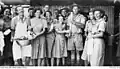 Legge (holding pot) and colleagues help clean up after Christmas dinner. Innisfail, 1943