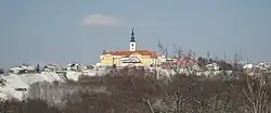 St. Urban's Church in Destrnik. The yellow buildings and the rest of the foreground is in the settlement of Janežovski Vrh.