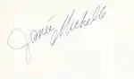 The handwritten name "Janée Michelle" in grey slanted from the bottom left to the top right all on a white background with the "M" curled under the first name