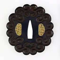 Japanese tsuba with geometric scrollwork design, not imitating plant forms, unknown date, shakudo and gold, Walters Art Museum, Baltimore, US