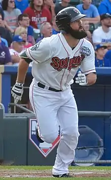 A baseball player in white