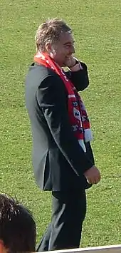 Jason McGill standing on a grass field