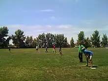 Vrugt (in green) playing softball with UC Irvine engineering faculty and students at annual Water & Environmental Engineering Picnic