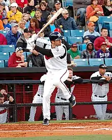 A baseball player in white