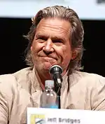 Jeff Bridges in front of a microphone during a press conference.